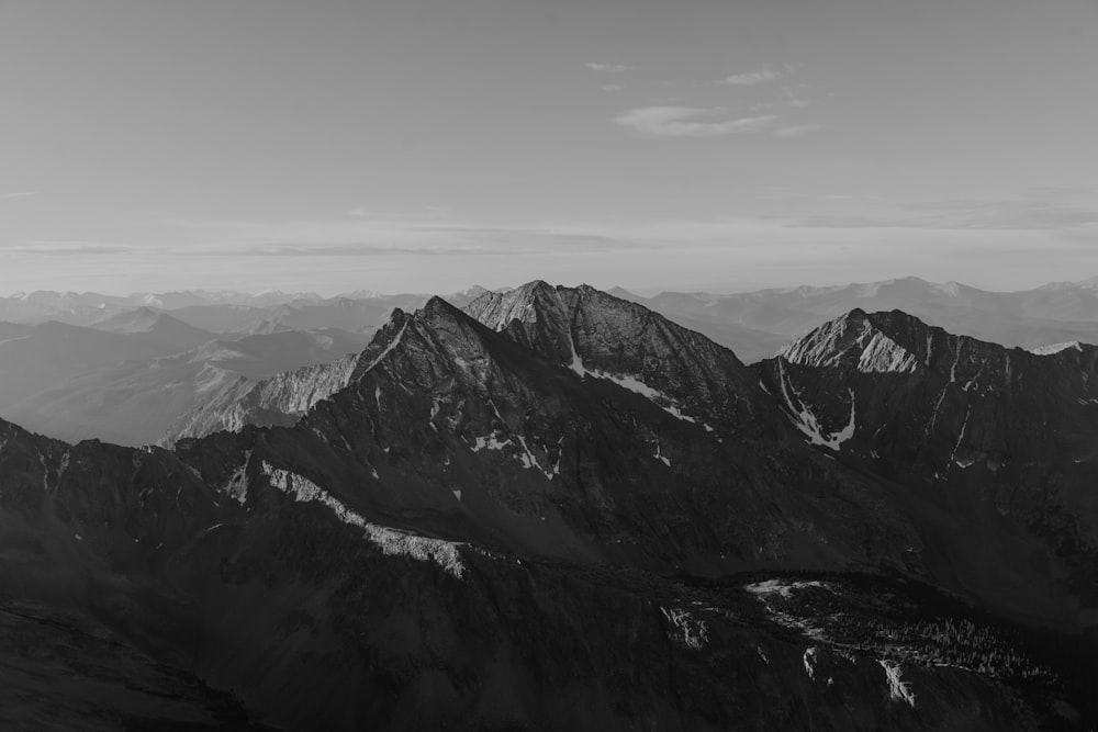 a black and white photo of a mountain range