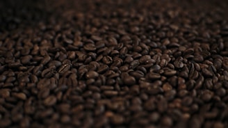 a pile of coffee beans is shown in this image