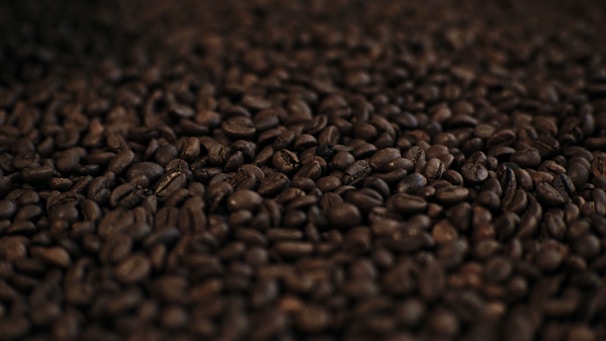 a pile of coffee beans is shown in this image