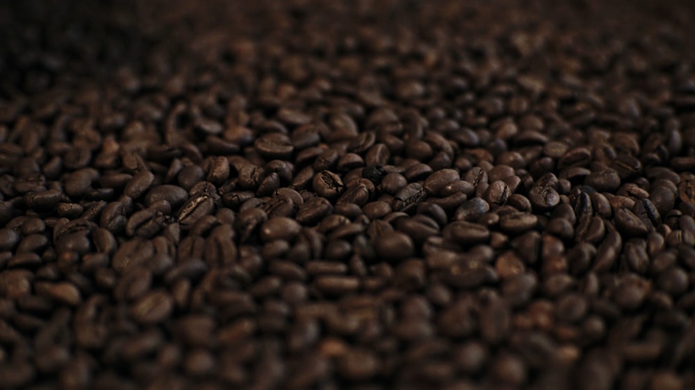 a pile of coffee beans is shown in this image