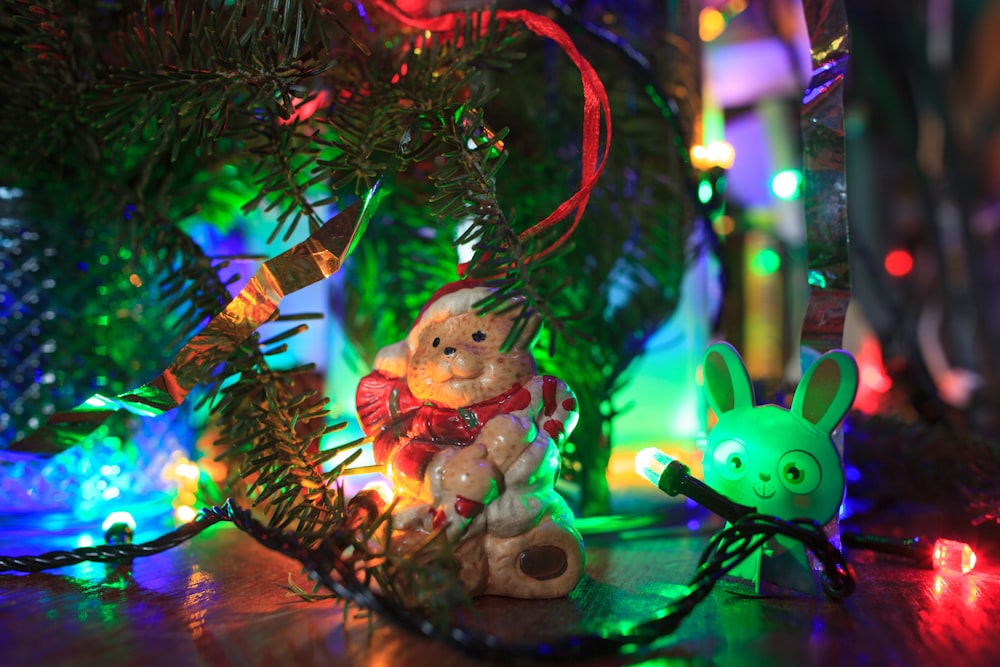 a christmas ornament with a teddy bear and a bunny on it
