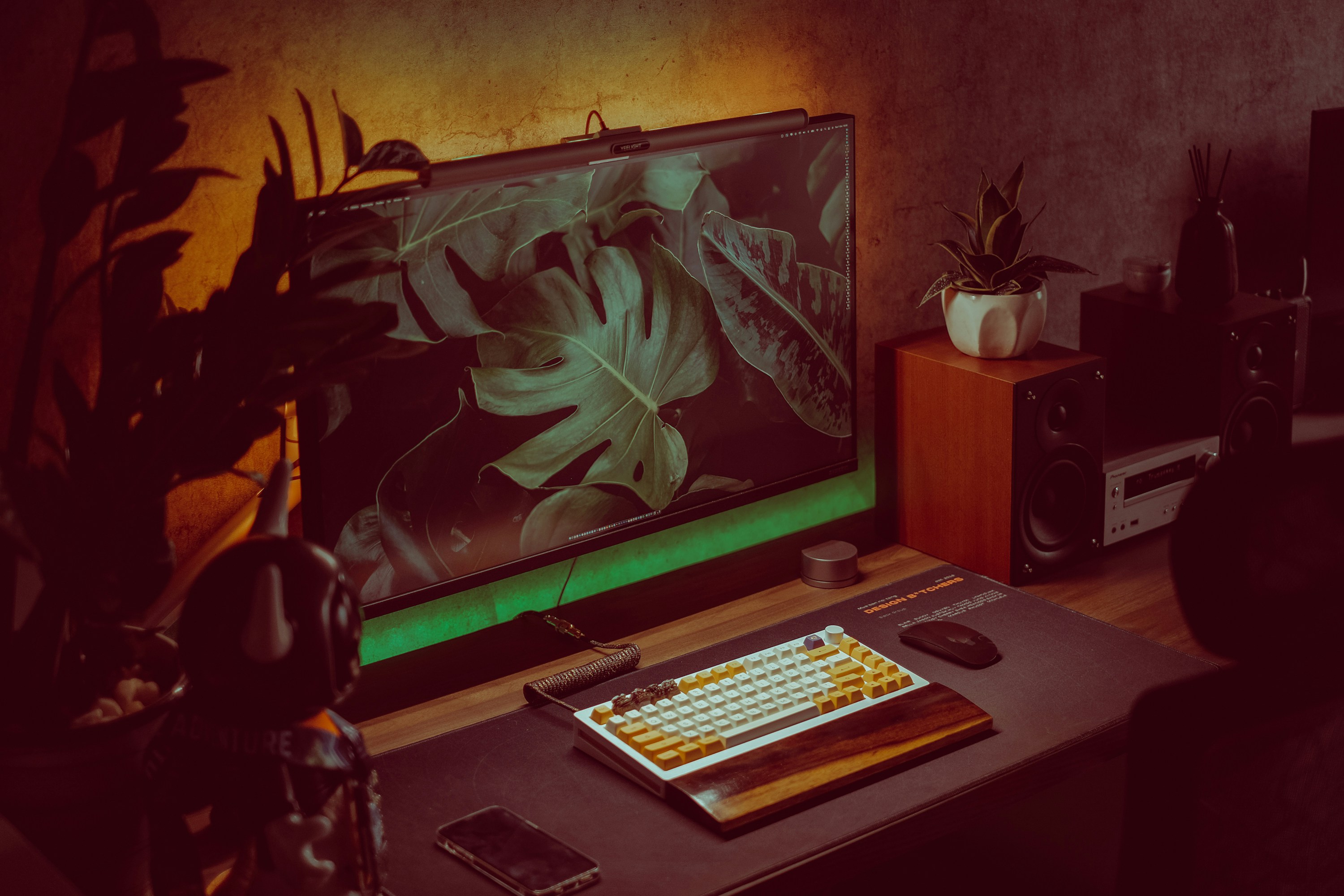 a desk with a keyboard and a monitor