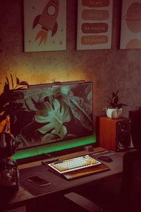 A cozy home office setup with a computer and plants.