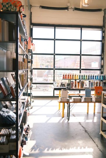 Bright and organized office supplies store interior with shelves full of stationery and furniture.