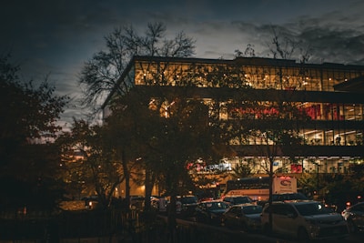 Evening view of Warehouse Coimbatore’s exterior with soft glowing lights inviting guests inside.