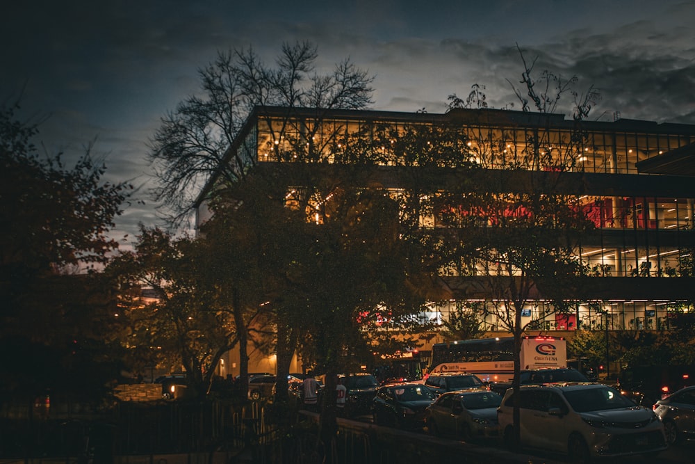 a building with a lot of cars parked in front of it