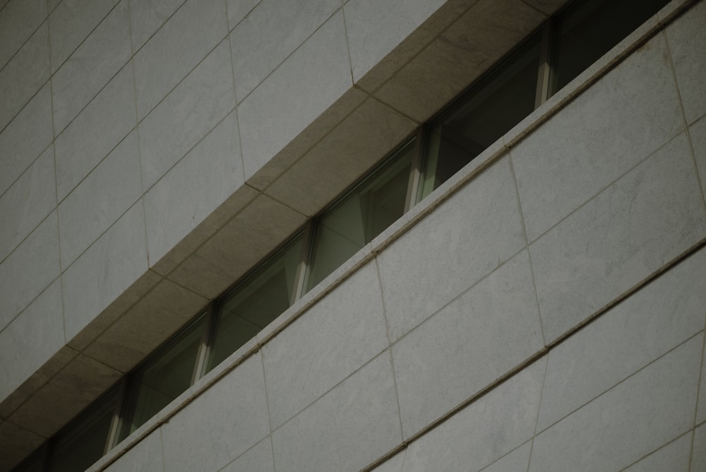 a close up of a building with a clock on the side of it