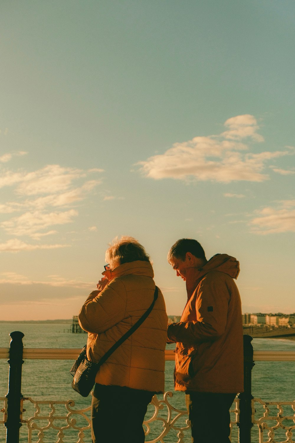 a couple of people standing next to each other