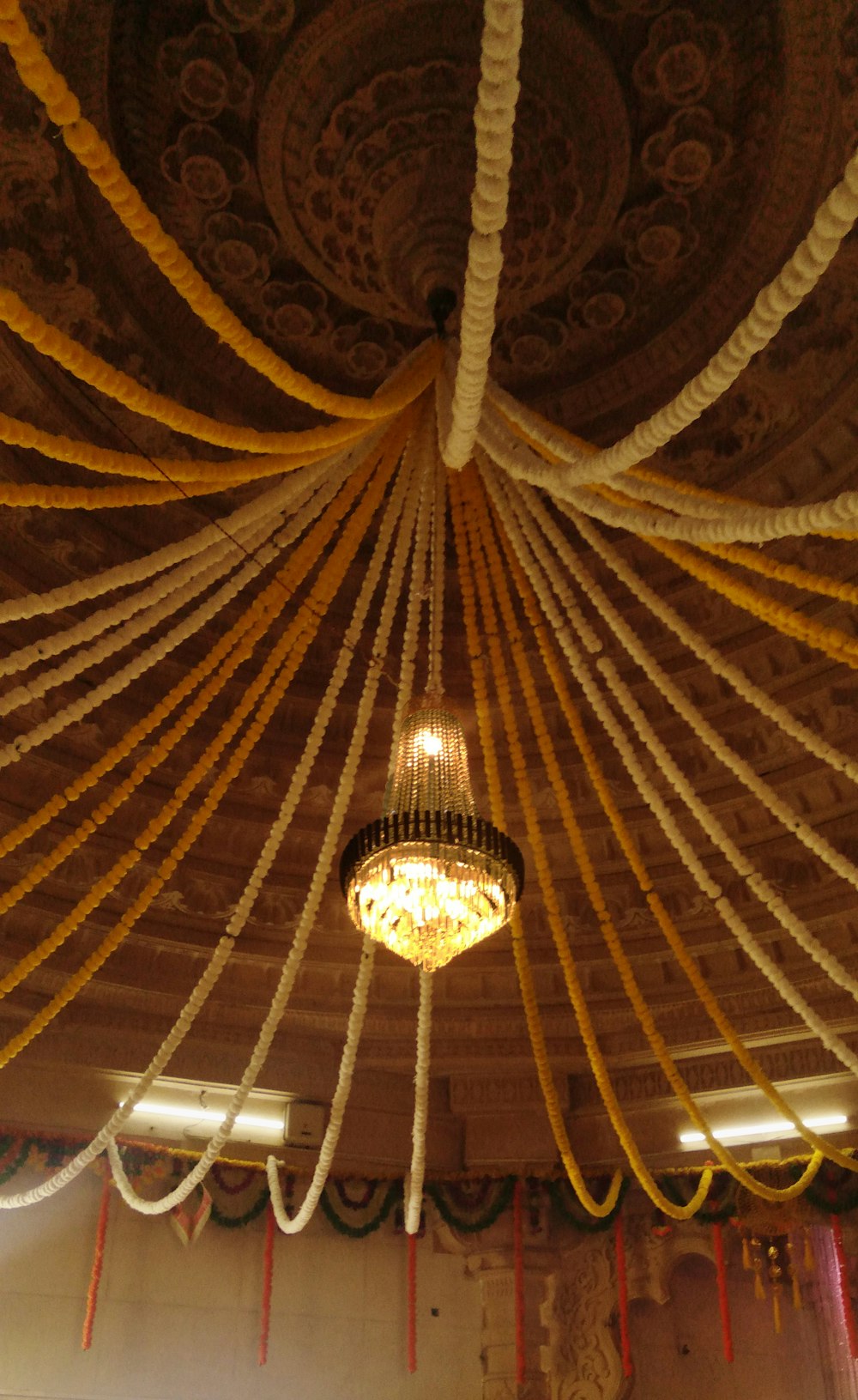 a chandelier hanging from the ceiling of a room