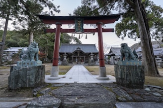 a statue of animals in front of a building