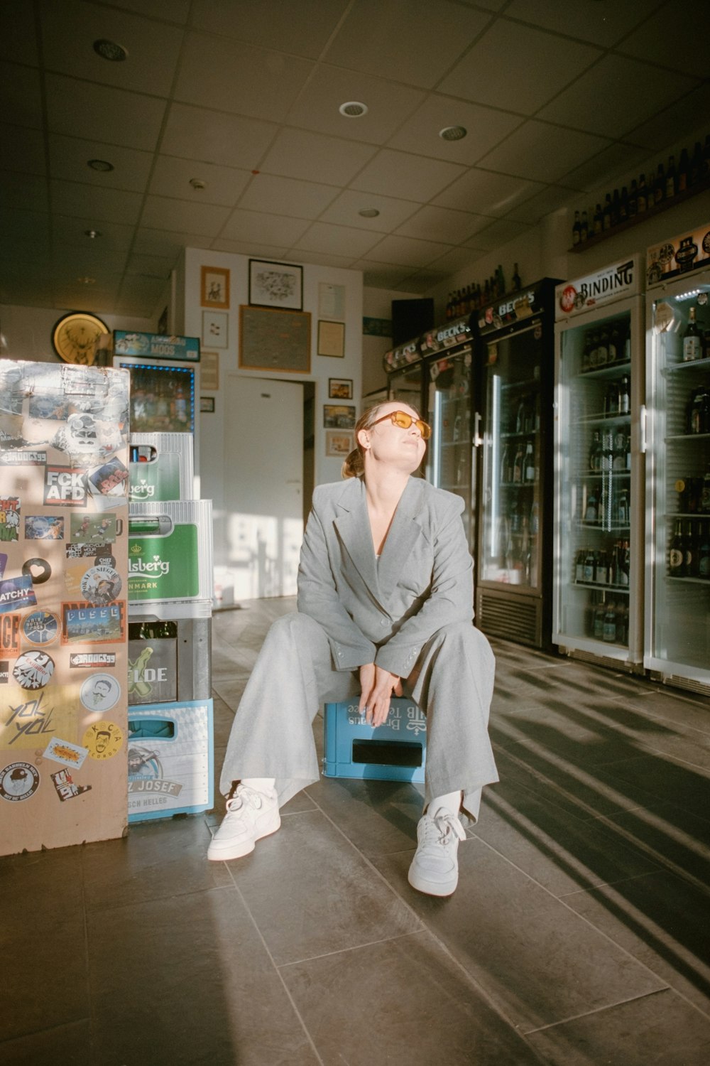 a woman sitting on a chair in a store