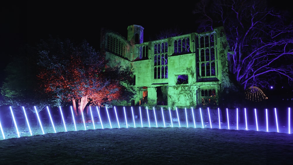 a building lit up with purple and blue lights