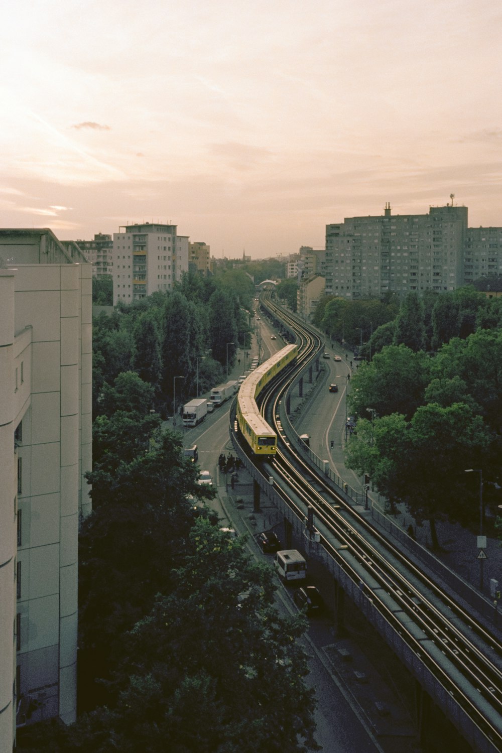 a train on a train track in a city