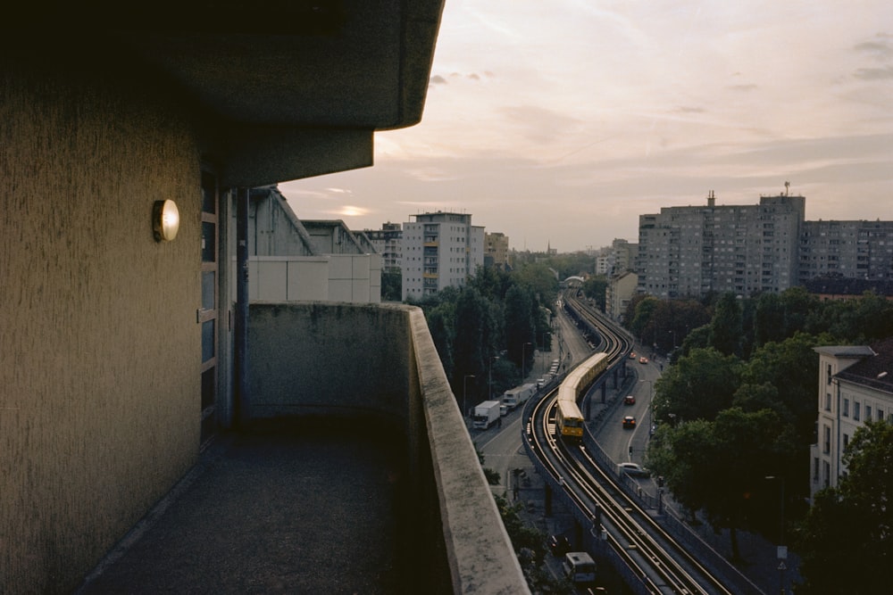 a view of a city with a train on the tracks