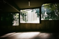 Natural light streaming through large windows in the consultation room.