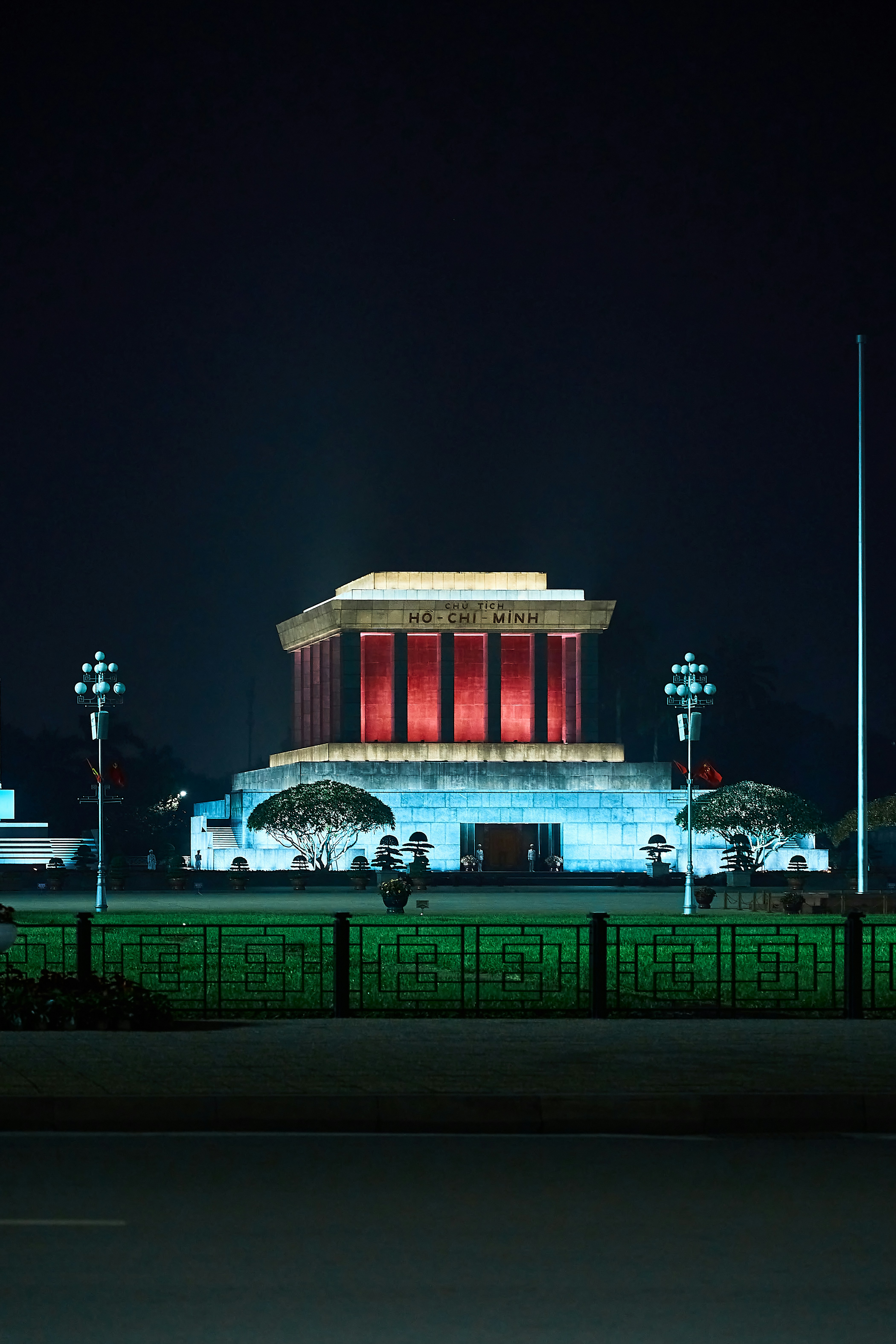 a building lit up at night with lights on it