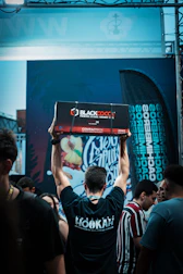 Hands inspecting premium coconut charcoal to ensure top quality.