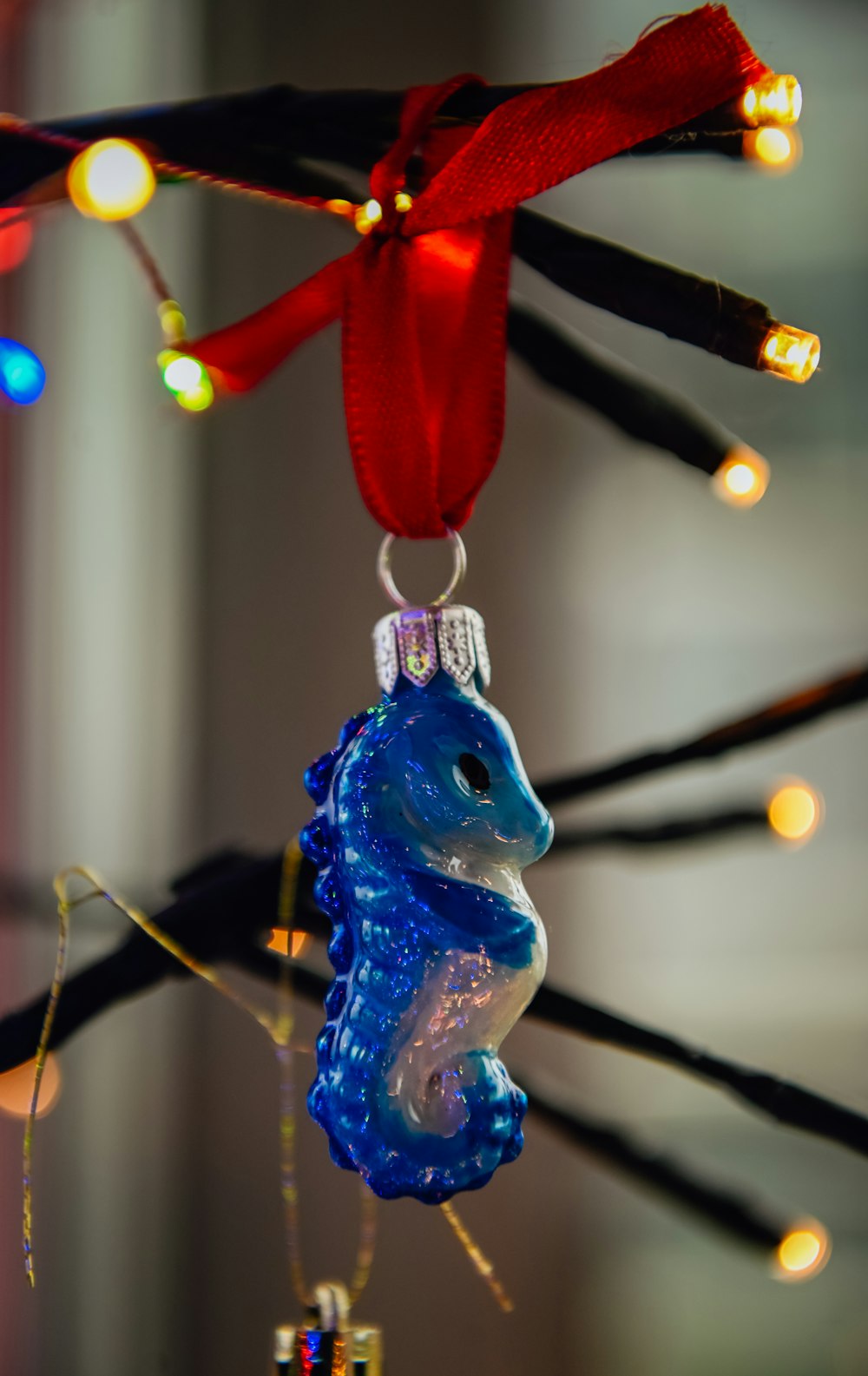 a glass ornament hanging from a tree
