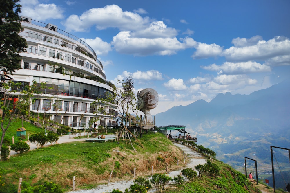 a building on top of a hill with a sky background