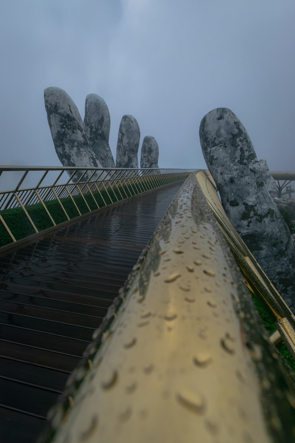 a very tall bridge with some big rocks on it