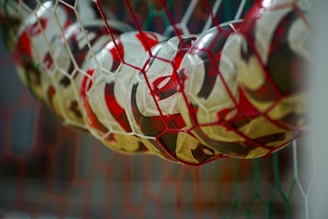 a close up of a soccer ball in a net