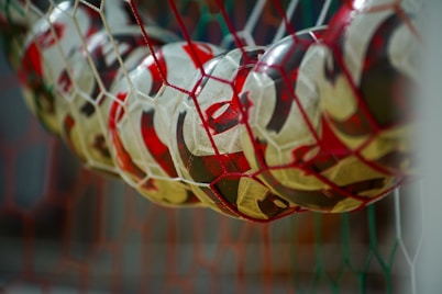 a close up of a soccer ball in a net