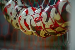 a close up of a soccer ball in a net
