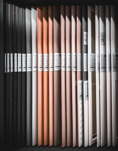 a row of books sitting on top of a shelf