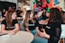 A group of diverse people engaged in a lively discussion about language learning.