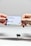 two hands holding a google credit card in front of an apple logo