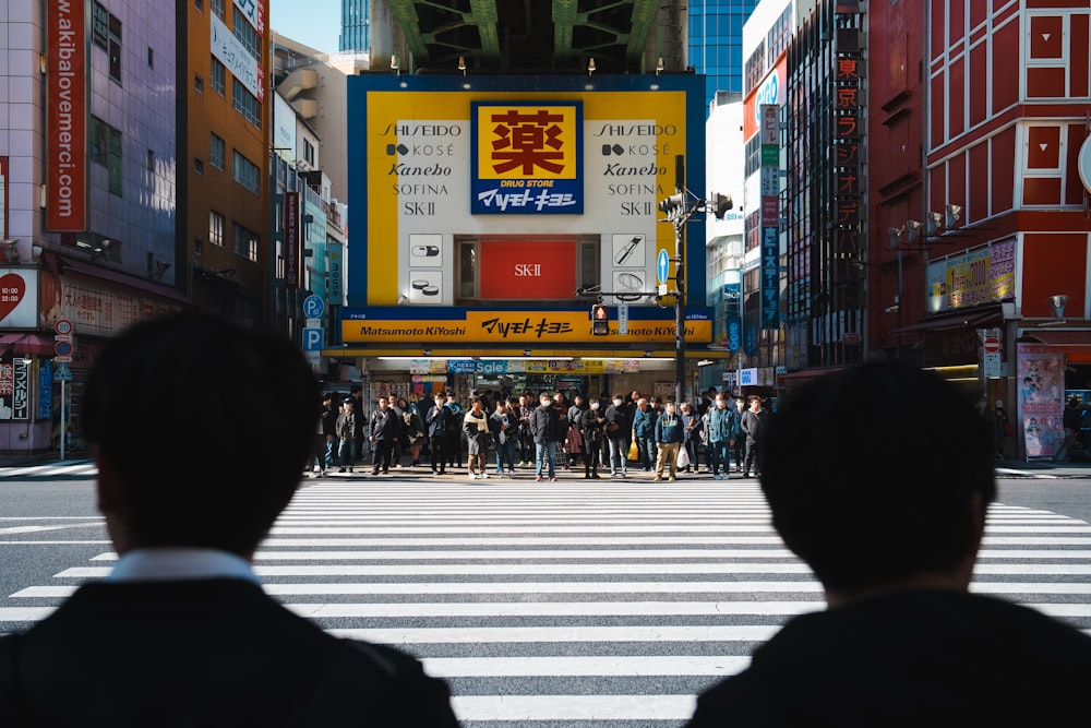 a couple of people that are standing in the street