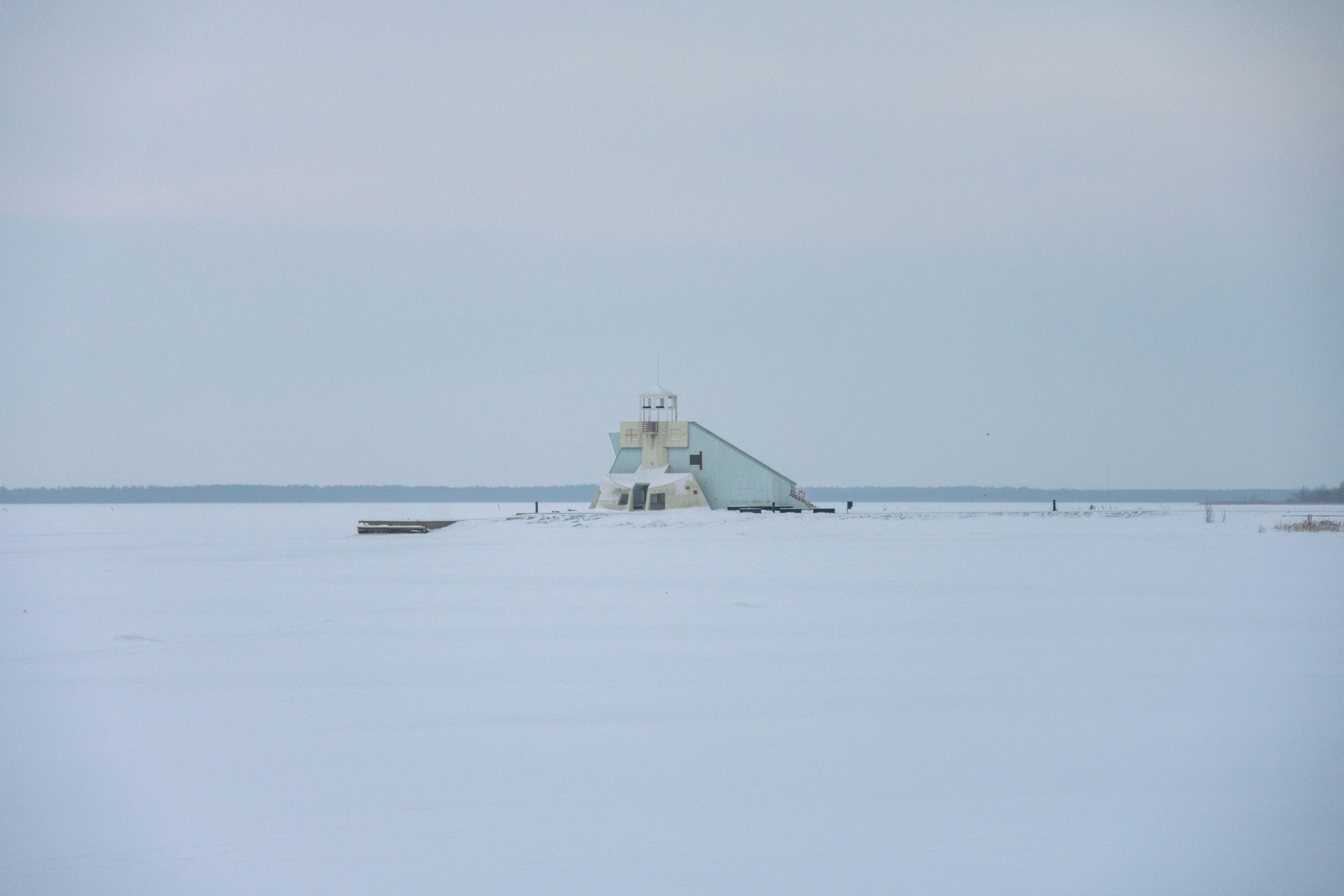 a lighthouse in the middle of a large body of water