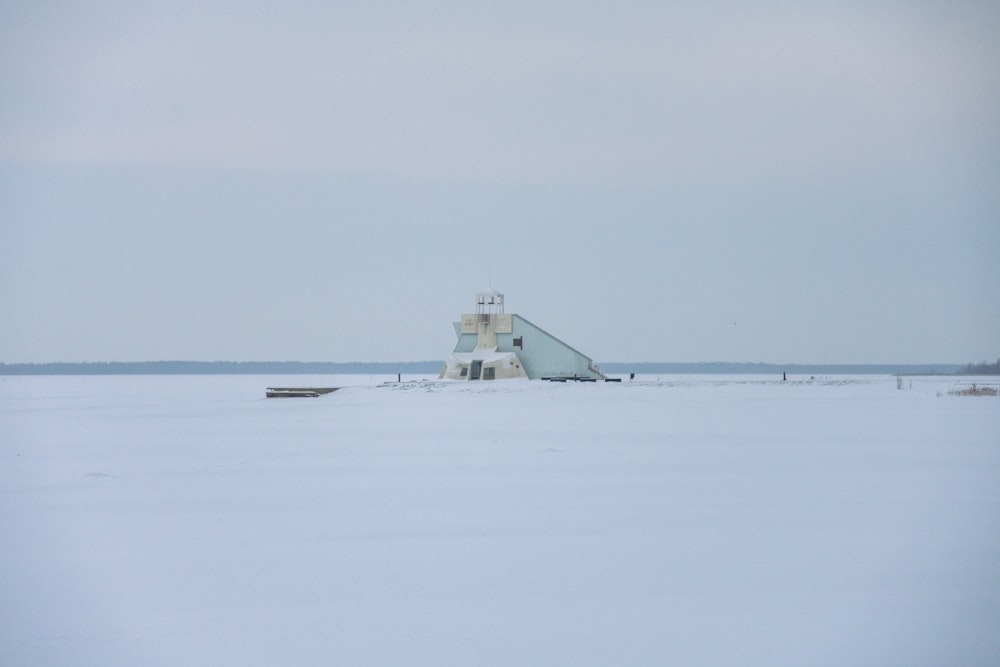 a lighthouse in the middle of a large body of water