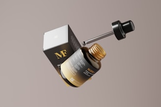 a dropper bottle with a dropper on top of it