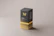 Sleek black and gold corporate gift box displayed on a polished desk.