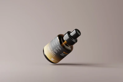 Floating glass product card featuring a sleek hair care bottle with a soft blur background.