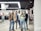 A group of friends shopping together at a clothing store.
