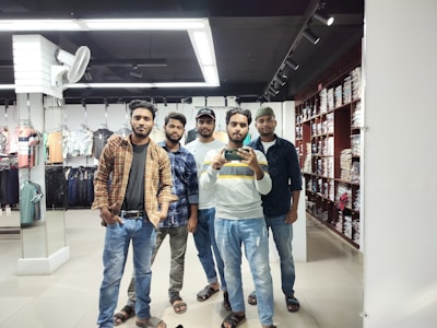 Smiling family members arranging clothes together in their store.