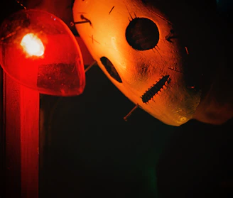 A close-up of Keluang Man’s iconic mask illuminated by the moonlight.