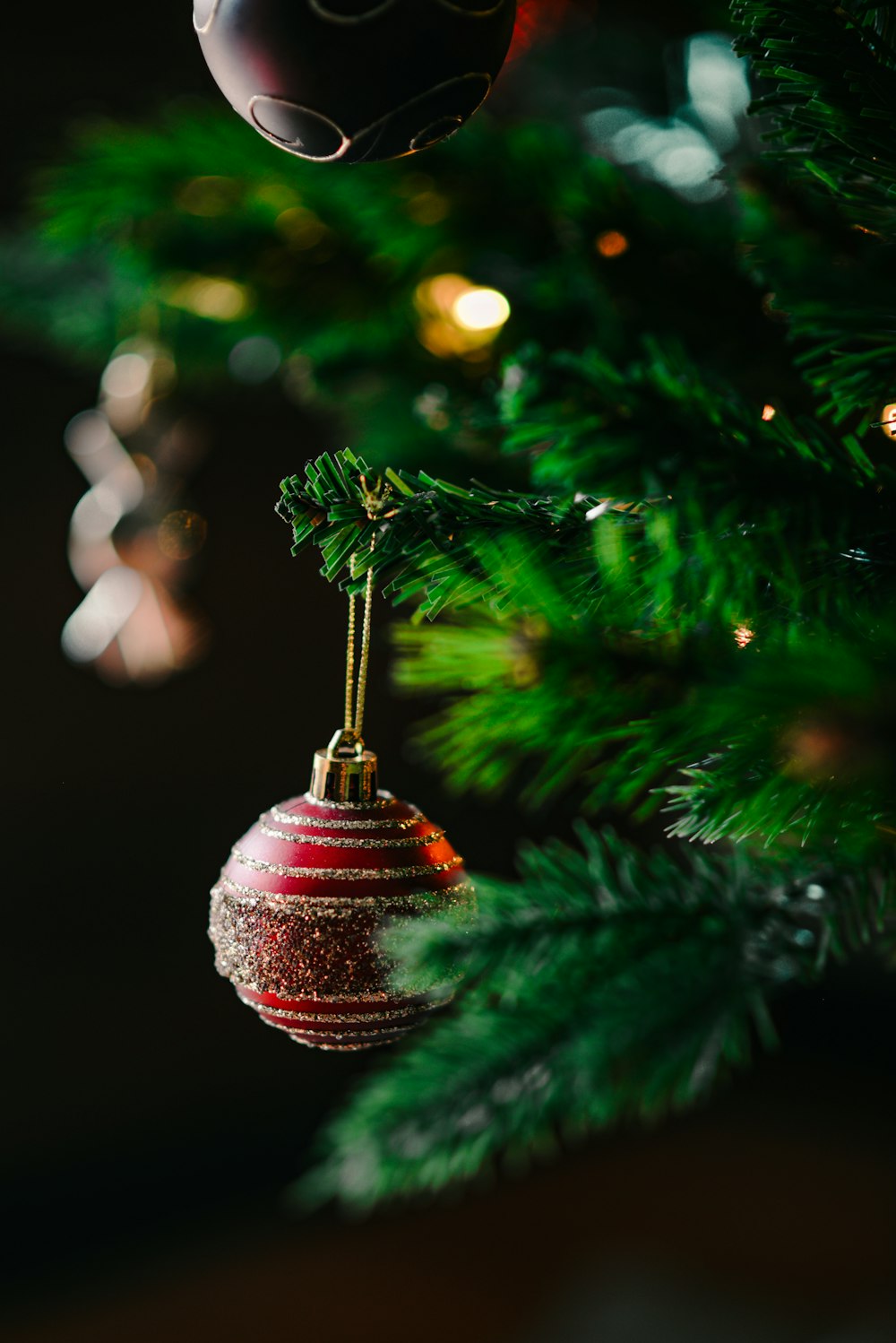 a christmas ornament hanging from a christmas tree