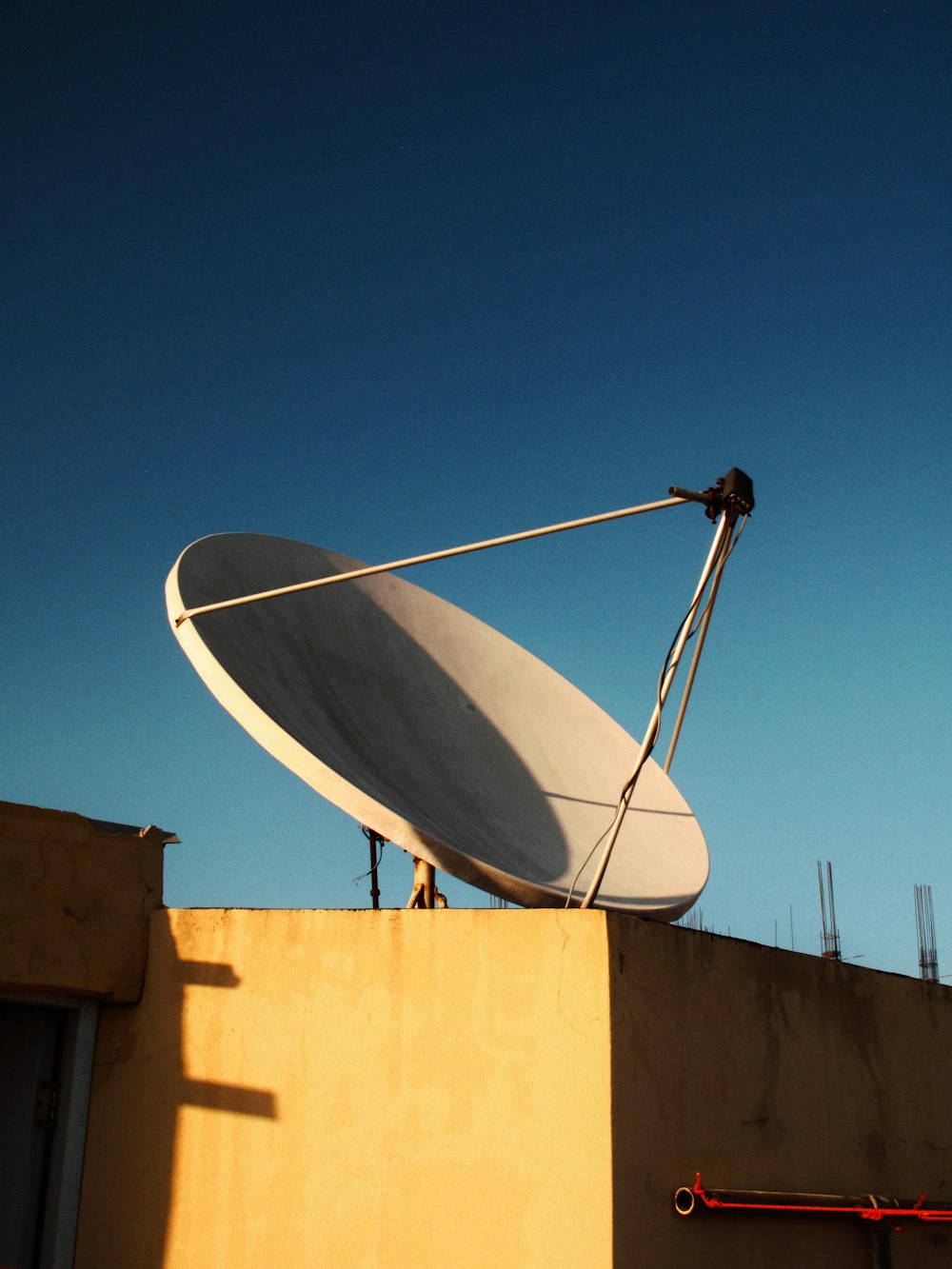 a satellite dish sitting on top of a building