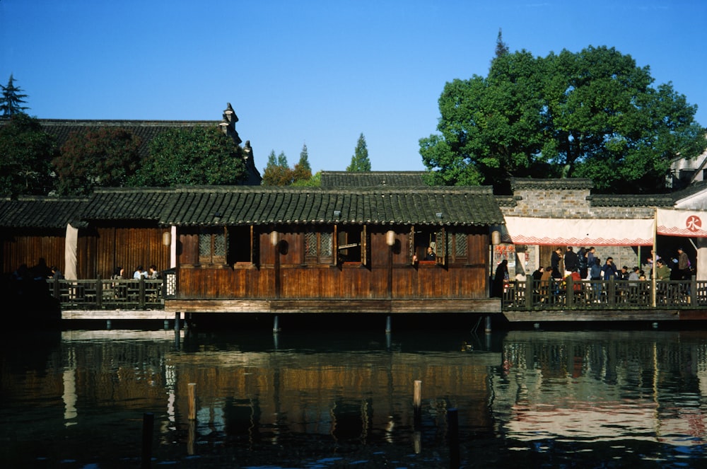 a house boat is docked in a river