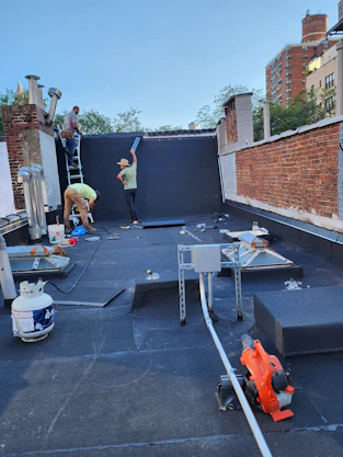 A skilled construction team collaborating on a residential renovation site in Brampton.