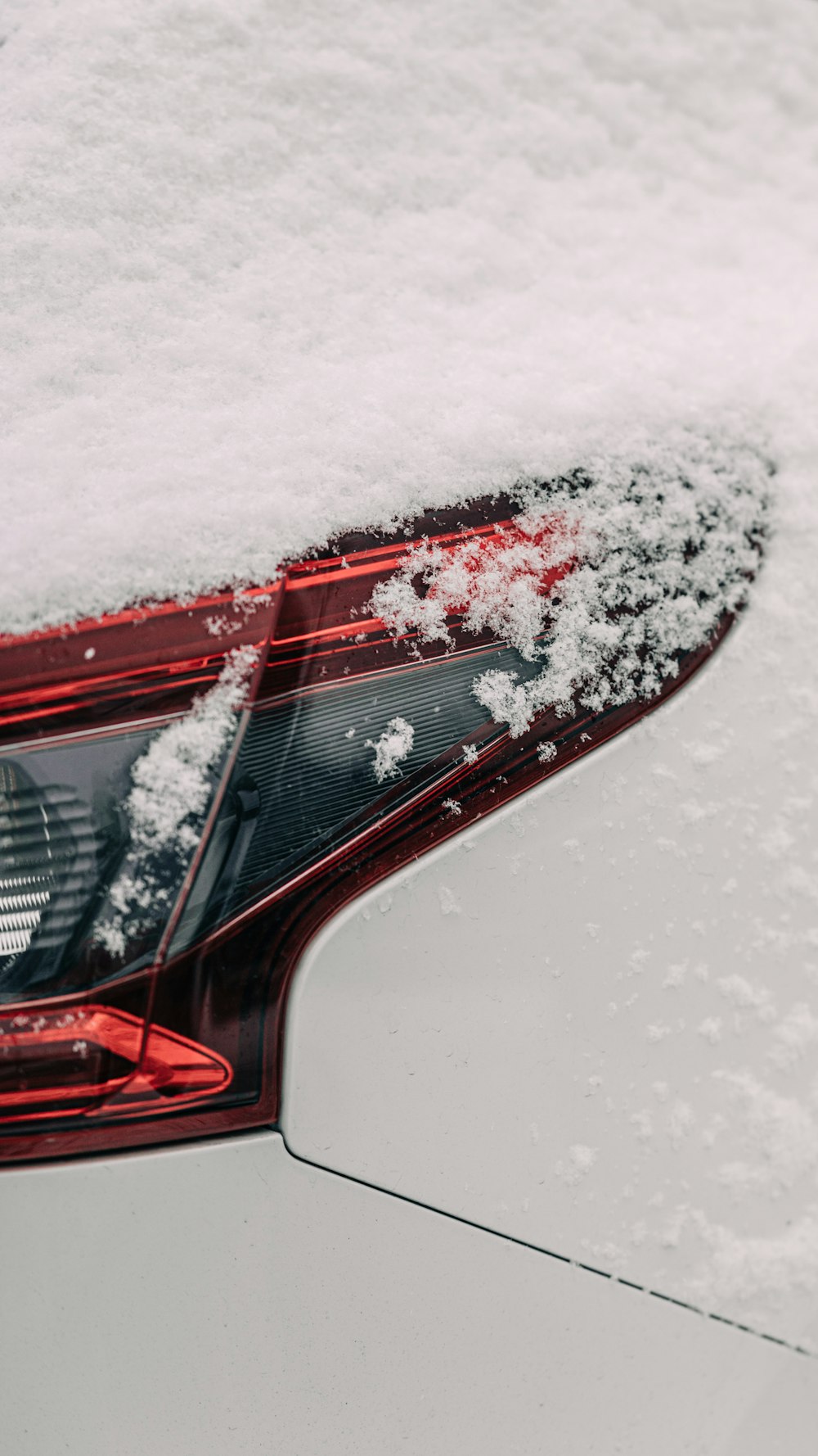a close up of a car covered in snow