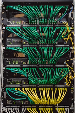 A network rack with patch cables patching into switches