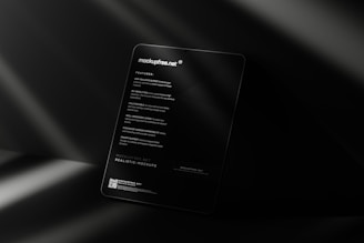 a black business card sitting on top of a table