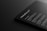 A dark-themed digital mockup showcasing a sleek, rounded-corner device featuring text that includes features and specifications. The text is white against a black background, giving a modern and minimalistic feel.