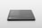 A sleek, rectangular black object with rounded corners rests on a light surface. Text in white is visible on its surface, listing features and specifications, suggesting it is a product mockup or digital screen template.