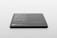 A sleek, rectangular black object with rounded corners rests on a light surface. Text in white is visible on its surface, listing features and specifications, suggesting it is a product mockup or digital screen template.