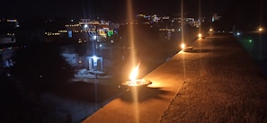 Festive lamps glowing brightly during a traditional religious celebration at dusk.
